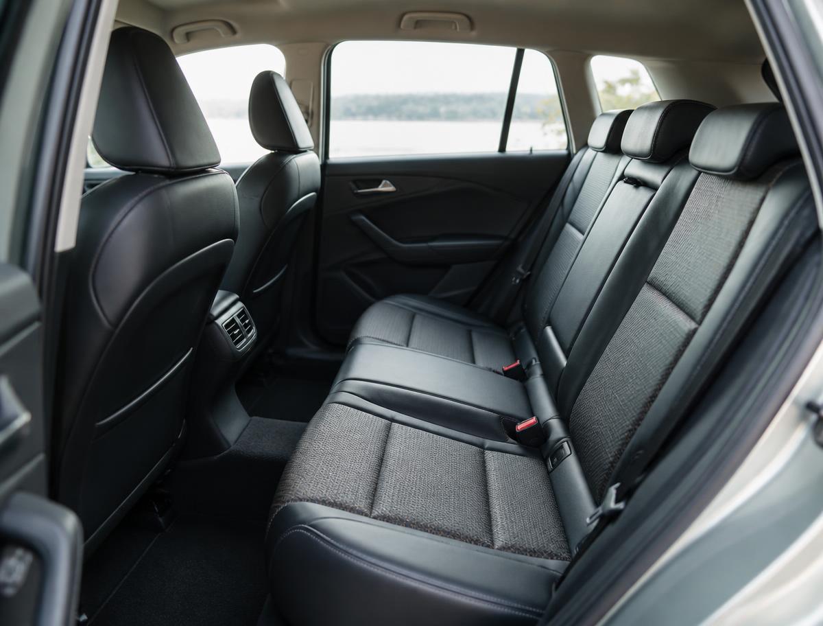 Clean and comfortable rear passenger seats inside a travel vehicle